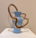Medium blue vessel with wavy handle by Lori Lyon